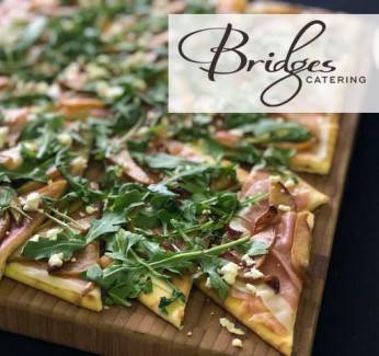 Large flatbread with Bridges Catering logo on the top right